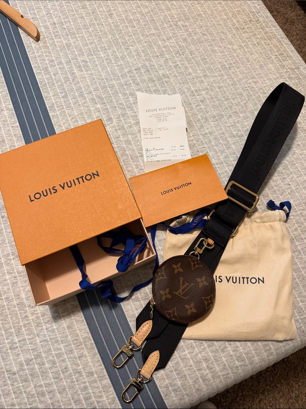 Louis Vuitton crossbody strap.